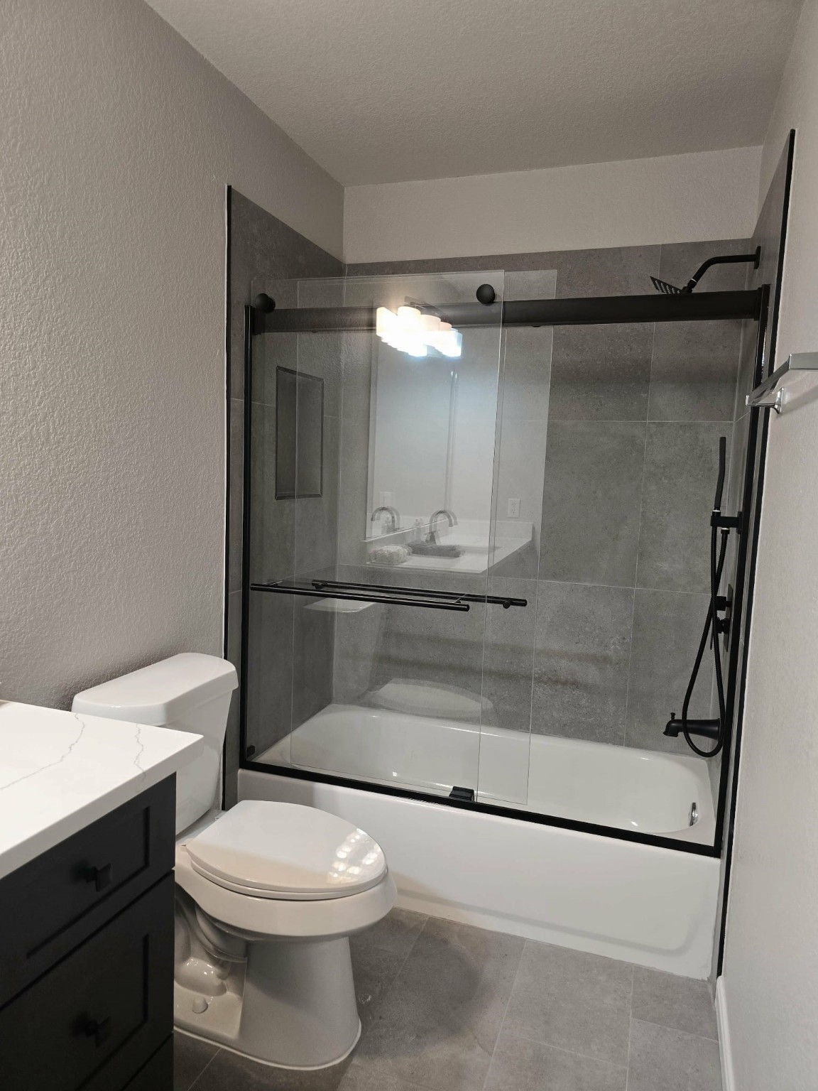 15618 Sweet Maple Court Houston, TX 77049 - Photo 9 of 23 a bathroom with a toilet a sink and shower