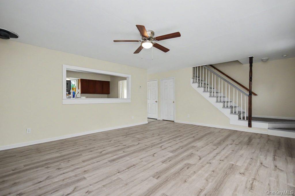 236 Bullville Road Montgomery, NY 12549 - Photo 10 of 29 Living room with stairway to second level