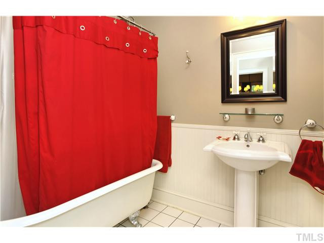 2306 Bedford Avenue Raleigh, NC 27607 - Photo 13 of 17 A great combination of classic charm and function. Claw foot tub is the centerpiece of this spacious second bath, private w/c area and nice lighting. Bathroom