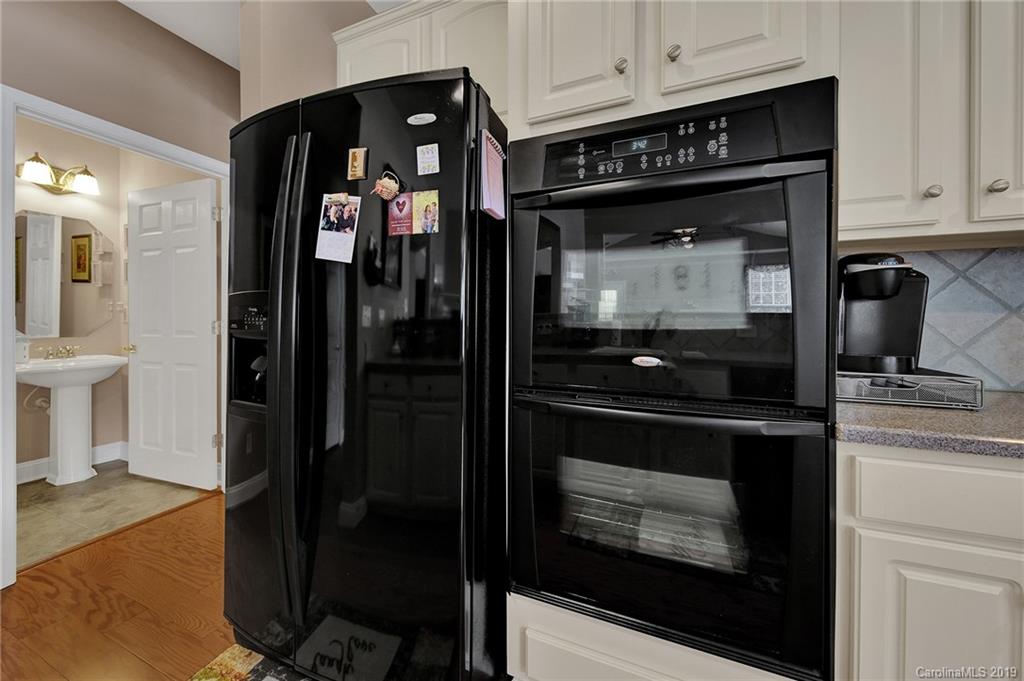 340 Garnet Court Fort Mill, SC 29708 - Photo 12 of 44 a kitchen with a stove and a refrigerator