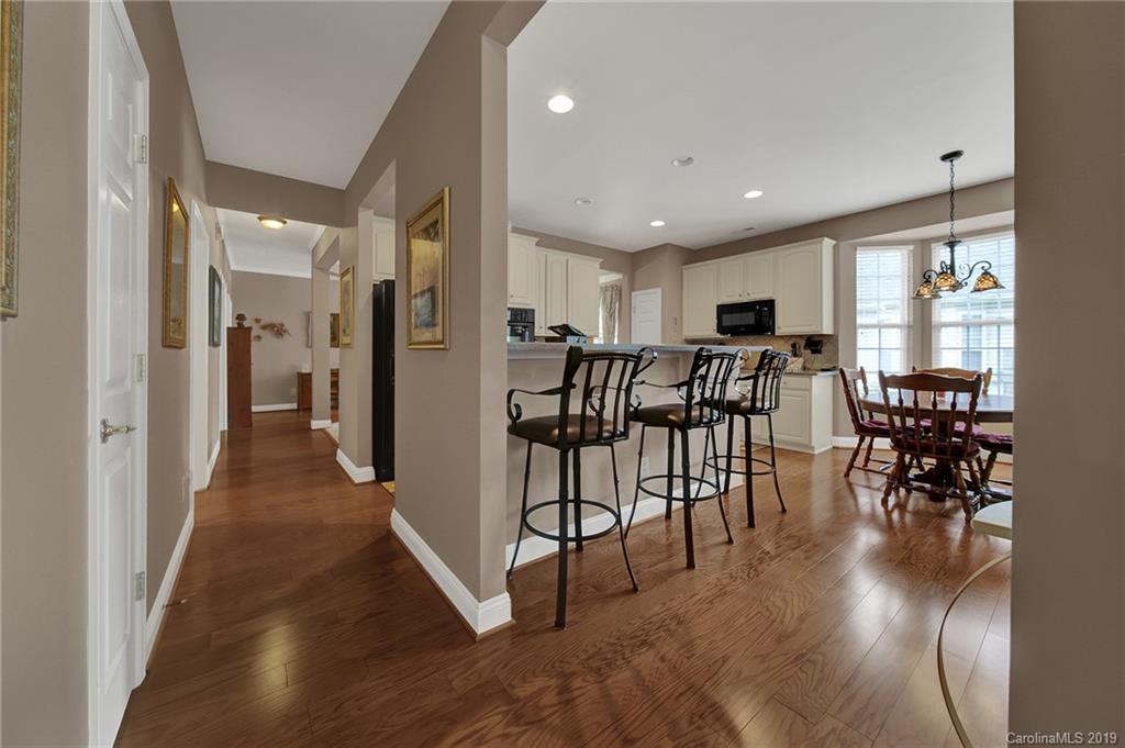 340 Garnet Court Fort Mill, SC 29708 - Photo 13 of 44 a view of a dining area with furniture window and wooden floor