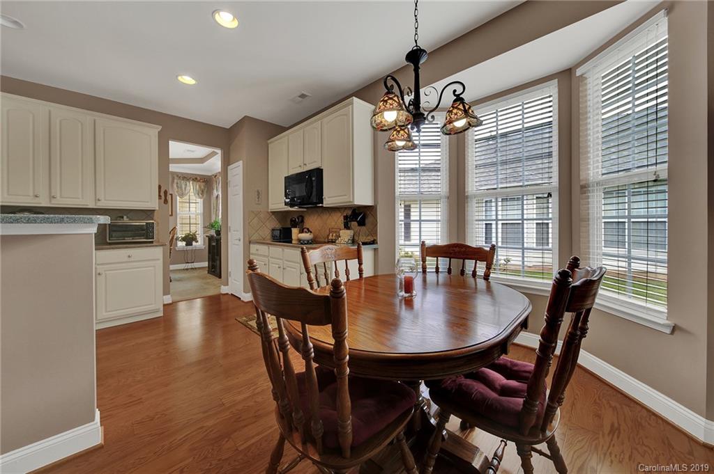 340 Garnet Court Fort Mill, SC 29708 - Photo 14 of 44 a view of a dining room with furniture window and wooden floor