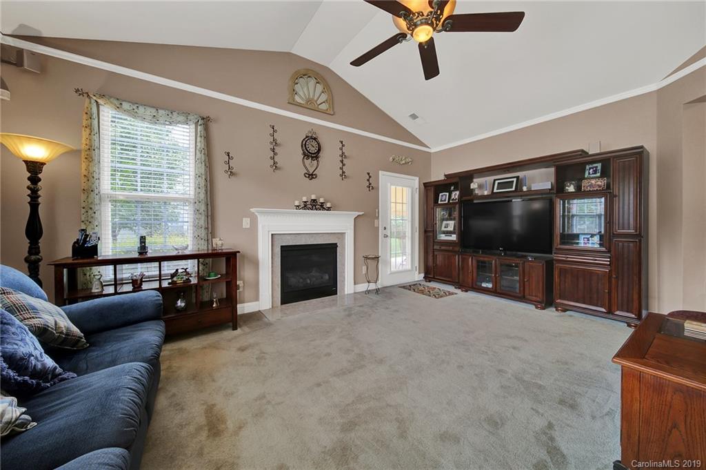 340 Garnet Court Fort Mill, SC 29708 - Photo 15 of 44 a living room with furniture and a flat screen tv