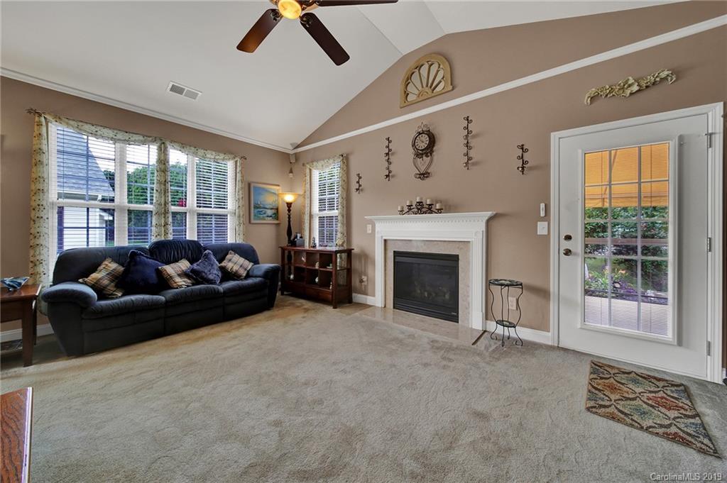340 Garnet Court Fort Mill, SC 29708 - Photo 17 of 44 a living room with furniture and a fireplace