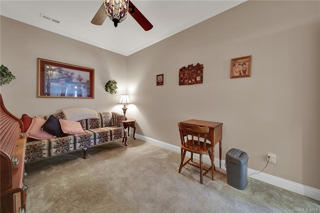 340 Garnet Court Fort Mill, SC 29708 - Photo 26 of 44 a bed room with furniture and a window