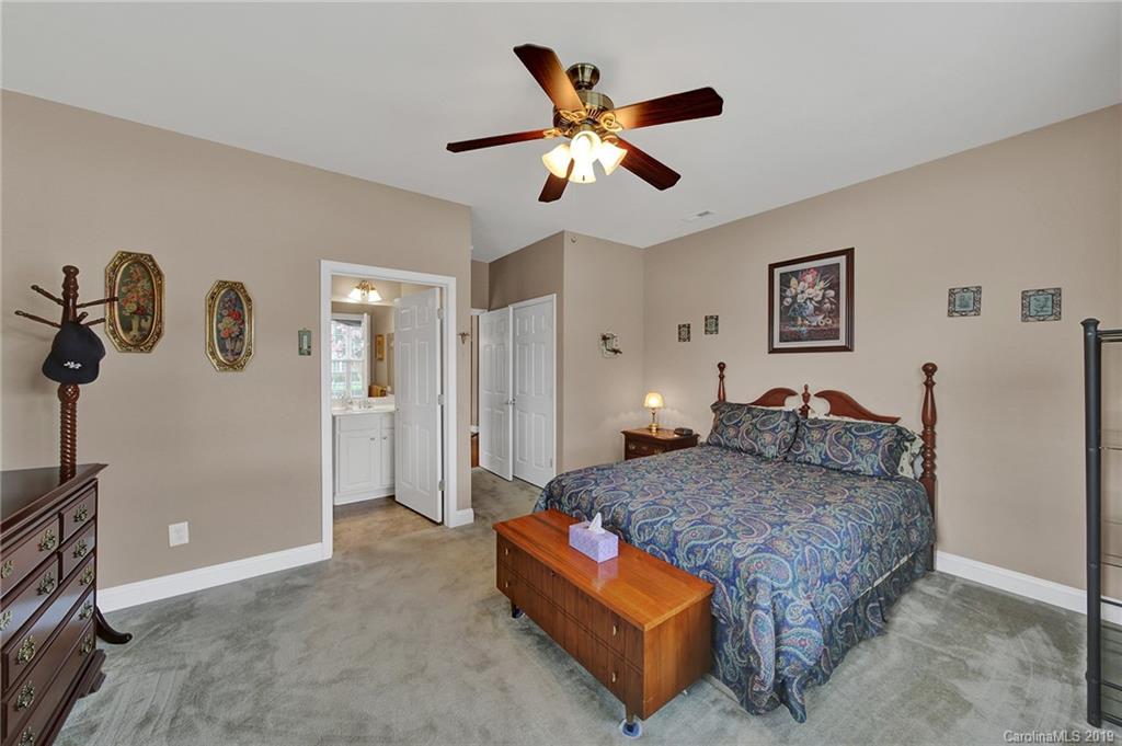 340 Garnet Court Fort Mill, SC 29708 - Photo 29 of 44 a bedroom with a bed and ceiling fan