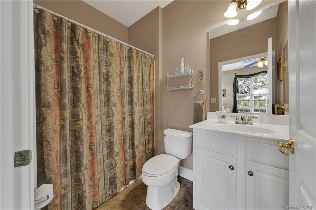 340 Garnet Court Fort Mill, SC 29708 - Photo 30 of 44 a bathroom with a sink a toilet and shower curtain