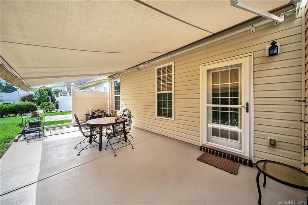 340 Garnet Court Fort Mill, SC 29708 - Photo 32 of 44 a backyard of a house with table and chairs