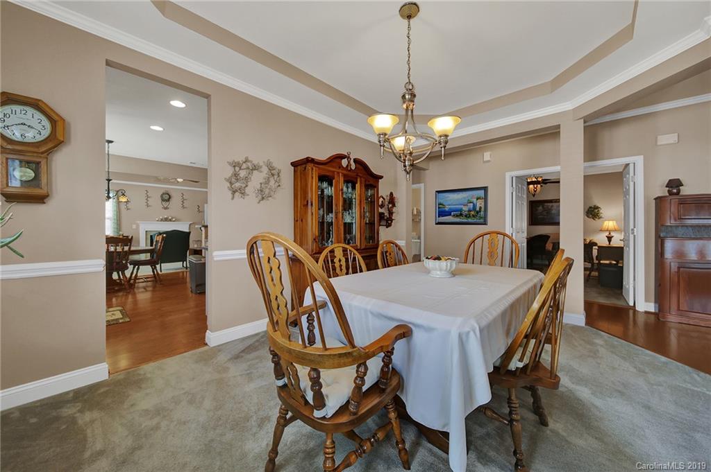 340 Garnet Court Fort Mill, SC 29708 - Photo 7 of 44 a view of a dining room with furniture and wooden floor