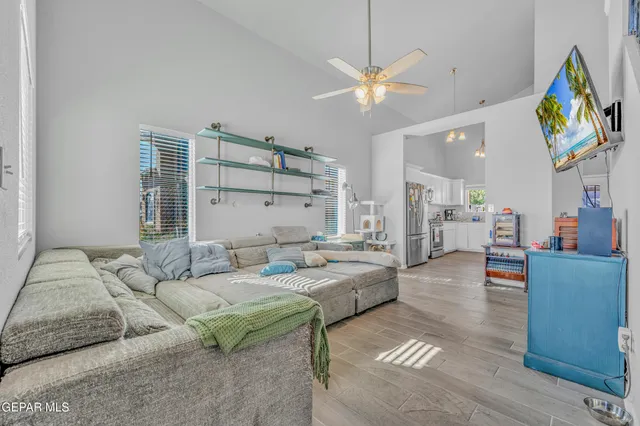 a kitchen with stainless steel appliances white cabinets and a refrigerator