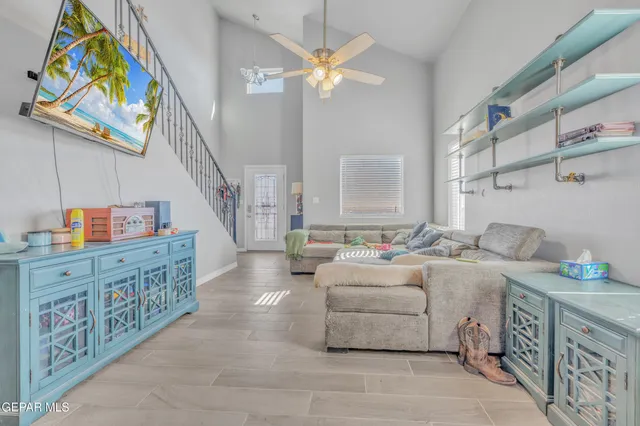 a kitchen with stainless steel appliances granite countertop white cabinets a sink and a stove