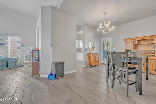 a bathroom with a granite countertop sink and a toilet