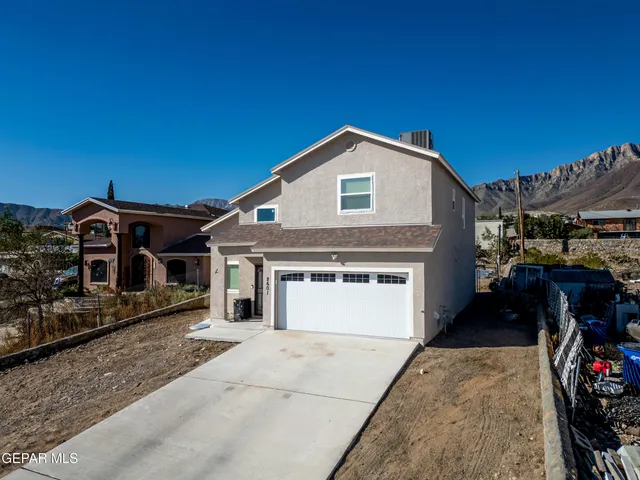 a front view of a house with yard