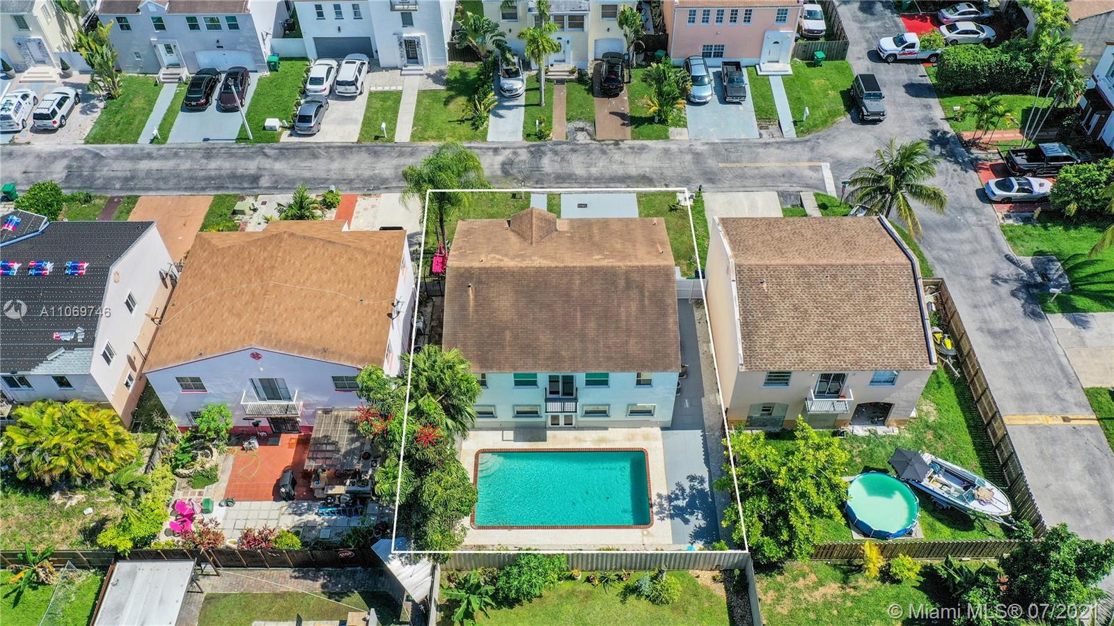 12121 Southwest 271st Street Homestead, FL 33032 - Photo 11 of 20 an aerial view of a house with a garden and plants