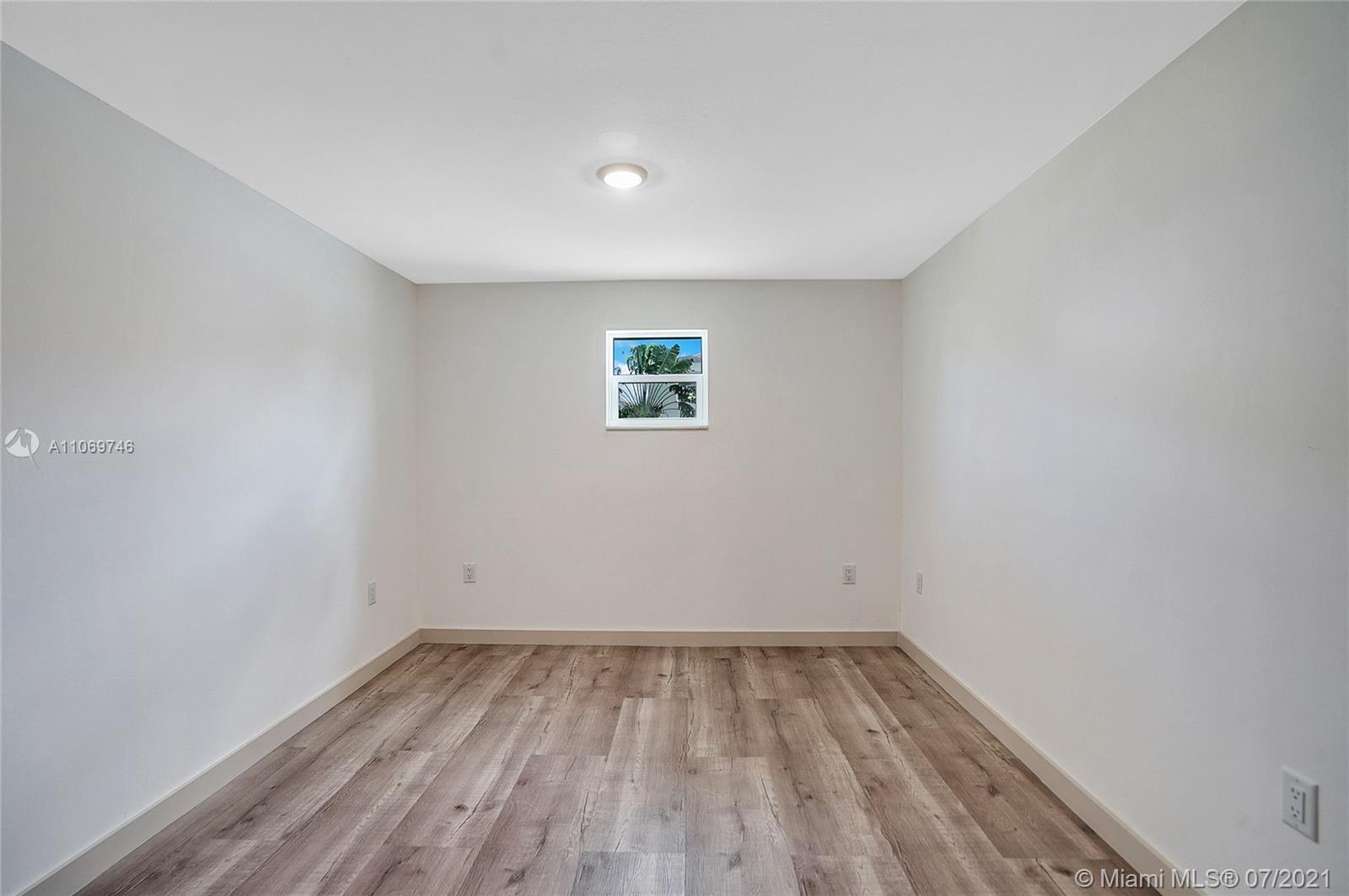 12121 Southwest 271st Street Homestead, FL 33032 - Photo 13 of 20 wooden floor in a room