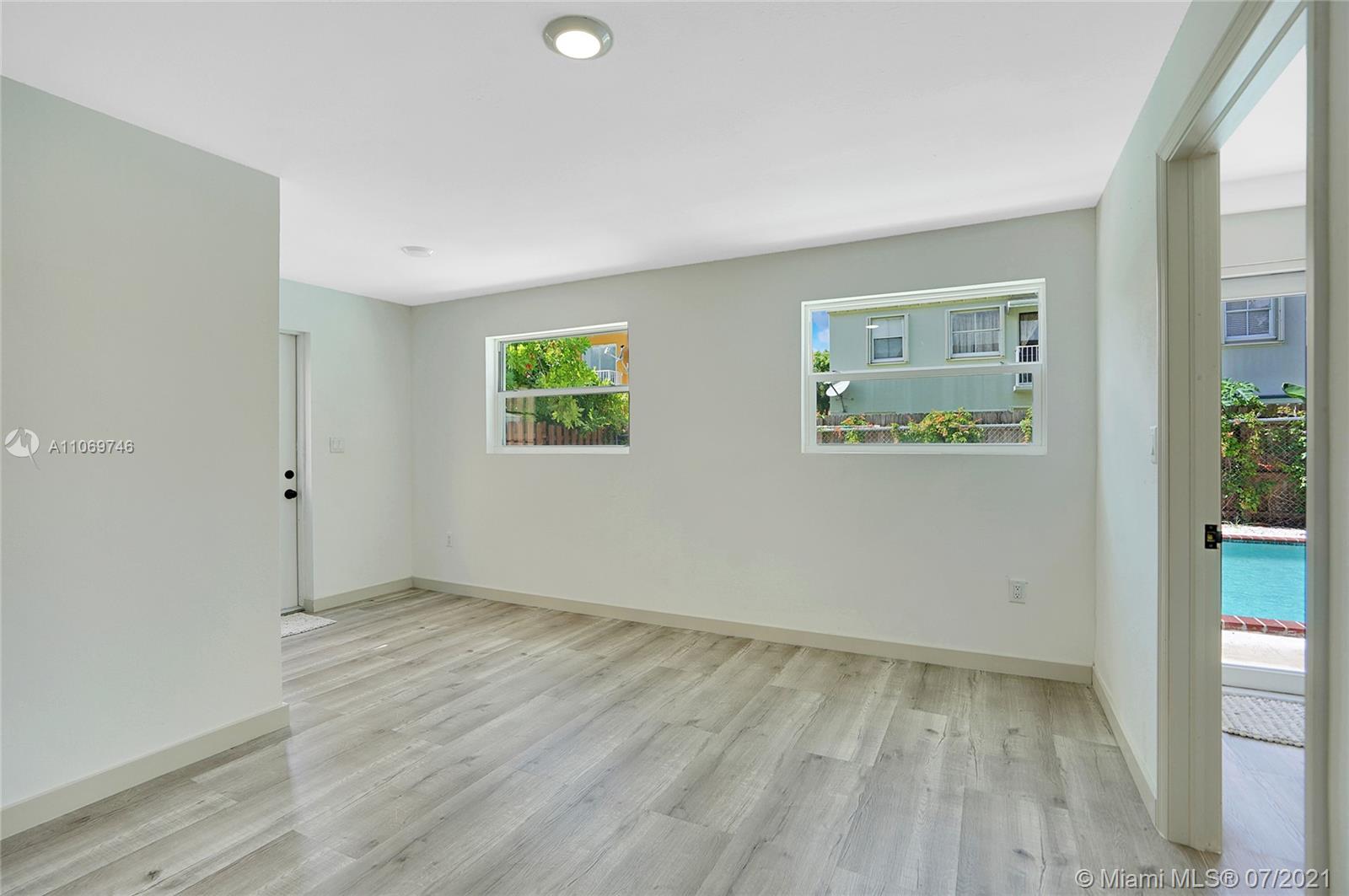 12121 Southwest 271st Street Homestead, FL 33032 - Photo 16 of 20 an empty room with windows and closet