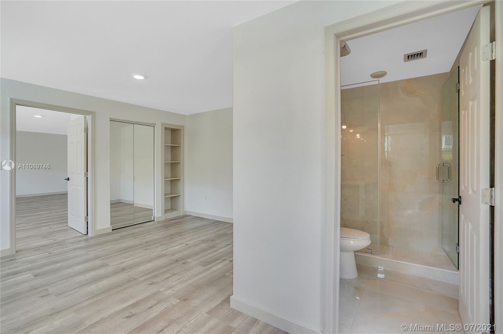 12121 Southwest 271st Street Homestead, FL 33032 - Photo 17 of 20 a bathroom with a shower and a toilet