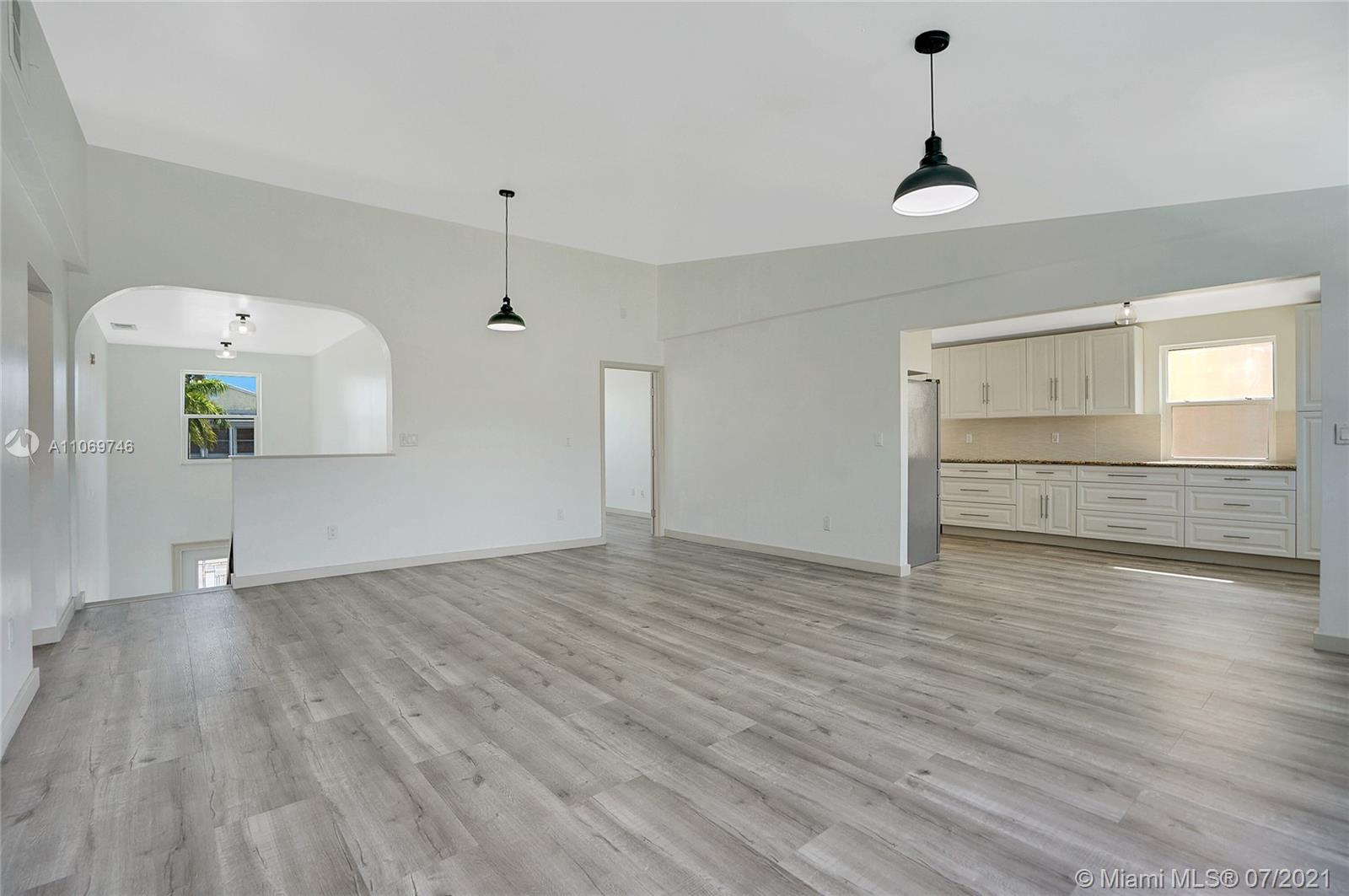 12121 Southwest 271st Street Homestead, FL 33032 - Photo 19 of 20 a view of empty room with wooden floor and window