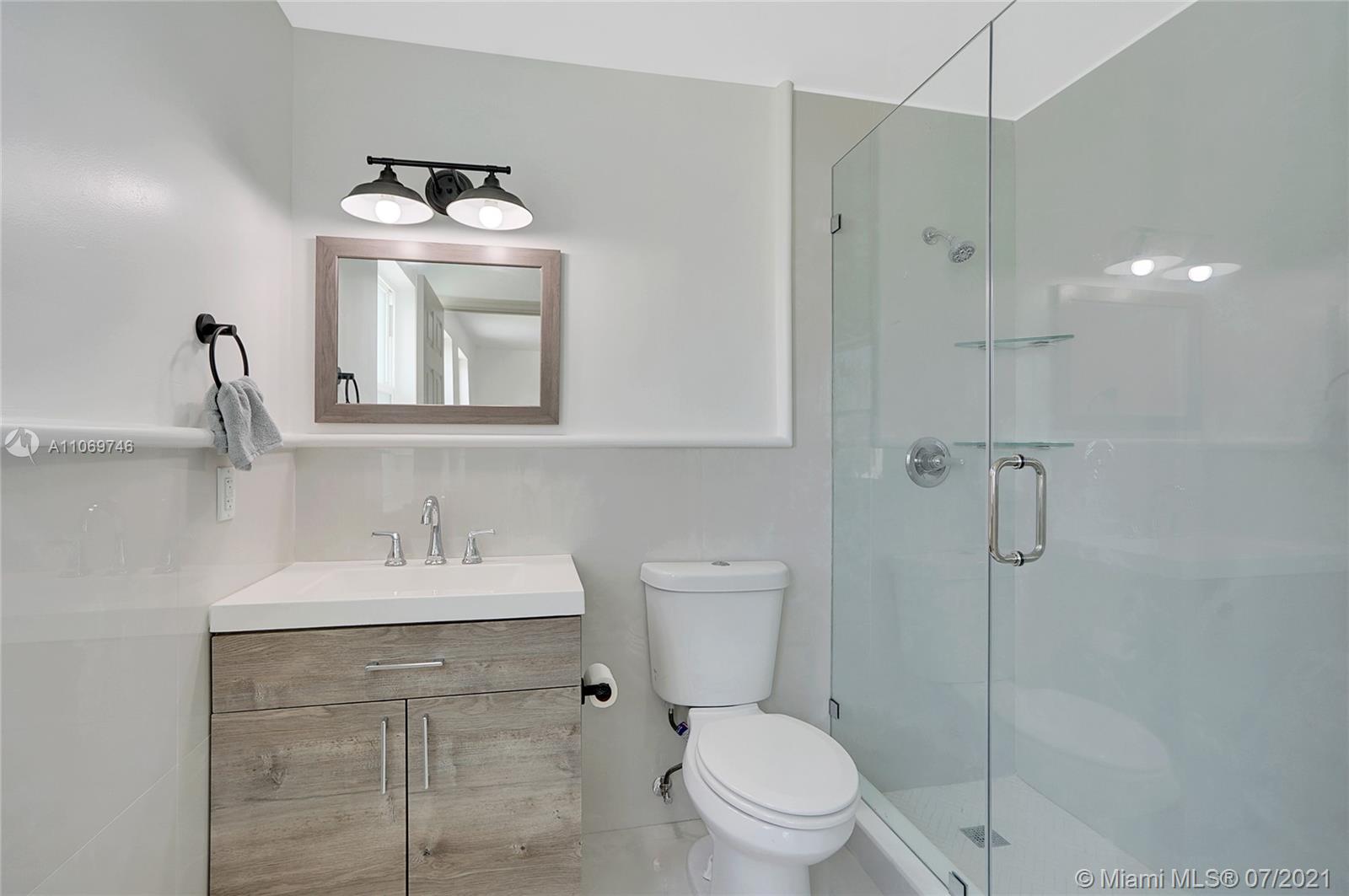 12121 Southwest 271st Street Homestead, FL 33032 - Photo 3 of 20 a bathroom with a sink toilet and shower