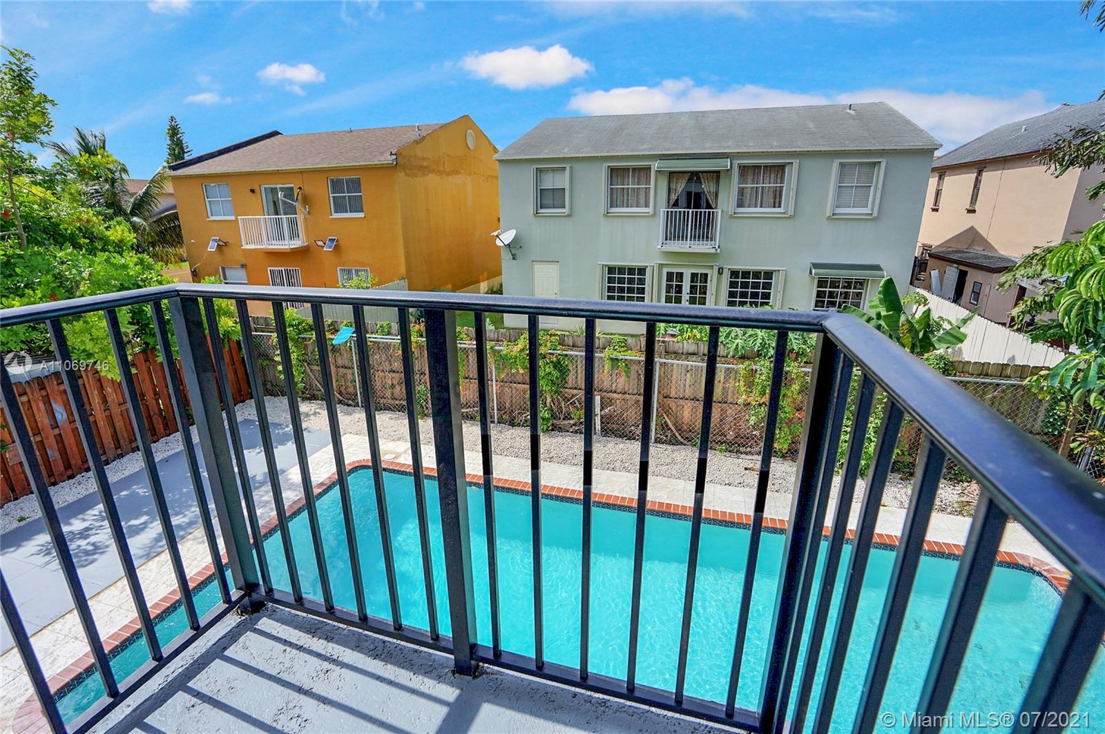 12121 Southwest 271st Street Homestead, FL 33032 - Photo 5 of 20 a front view of a house with a porch