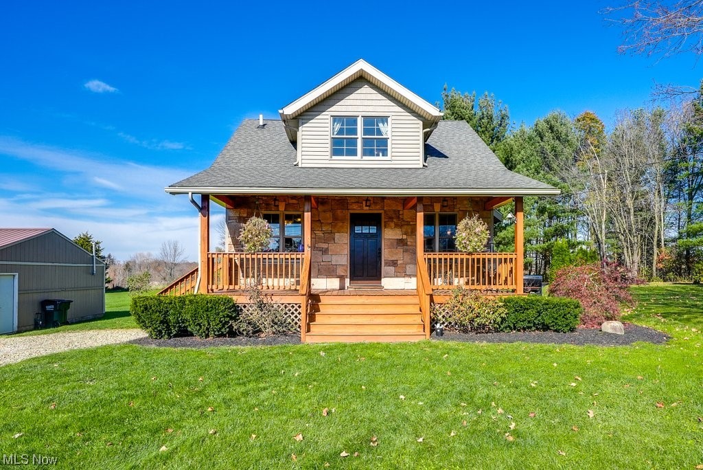 3417 Lake Rockwell Road Ravenna, OH 44266 - Photo 1 of 35 View of front of house featuring a front lawn and covered porch