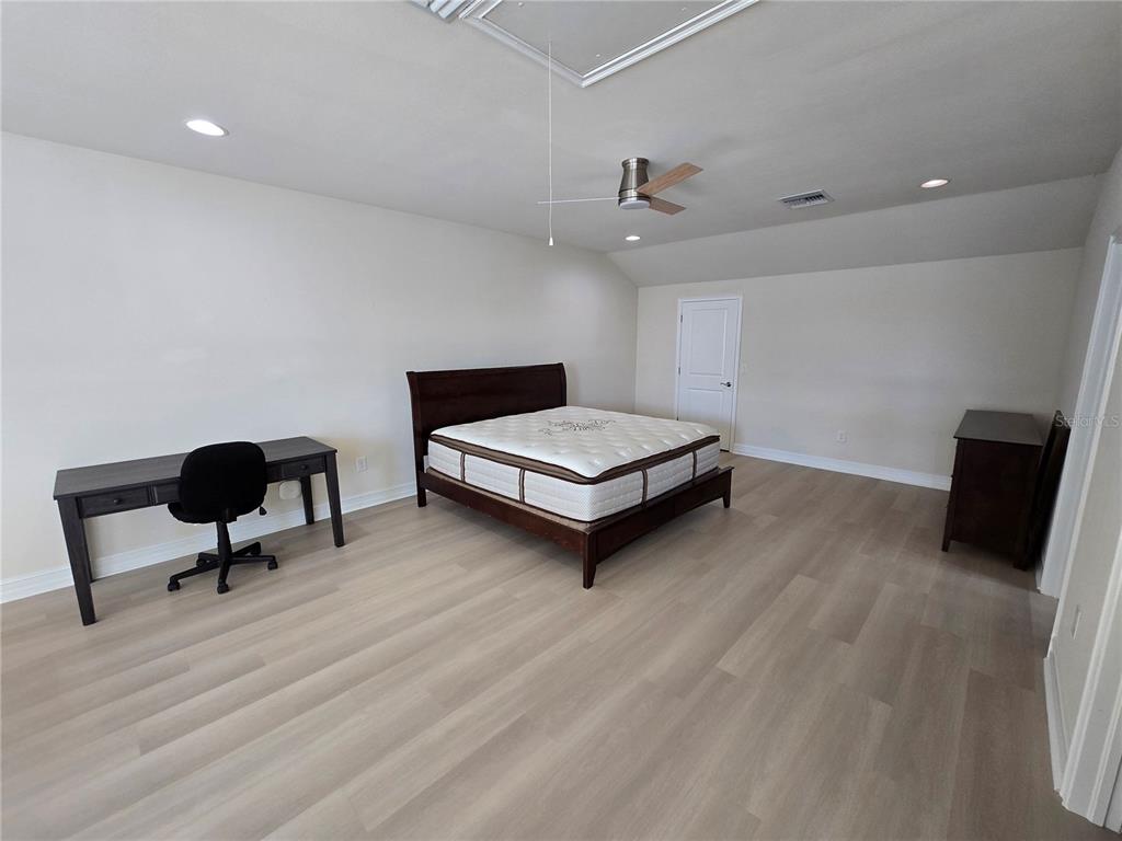 11925 Perennial Place Lakewood Ranch, FL 34211 - Photo 18 of 39 a living room with furniture and a chair