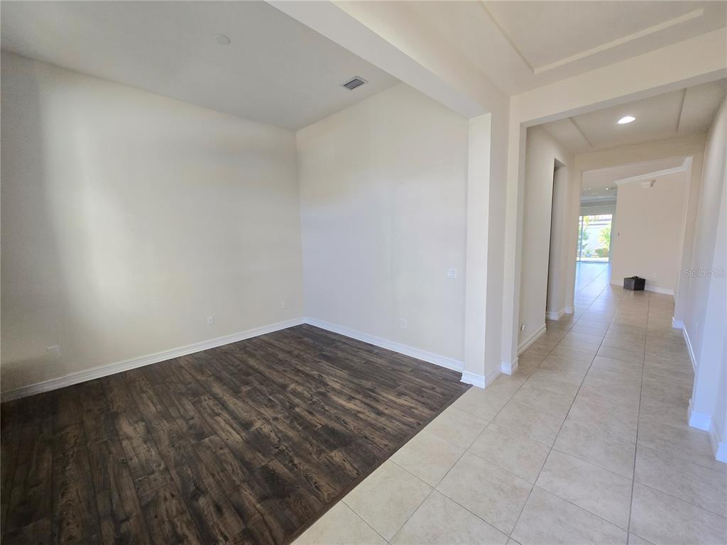 11925 Perennial Place Lakewood Ranch, FL 34211 - Photo 22 of 39 a view of hallway with wooden floor