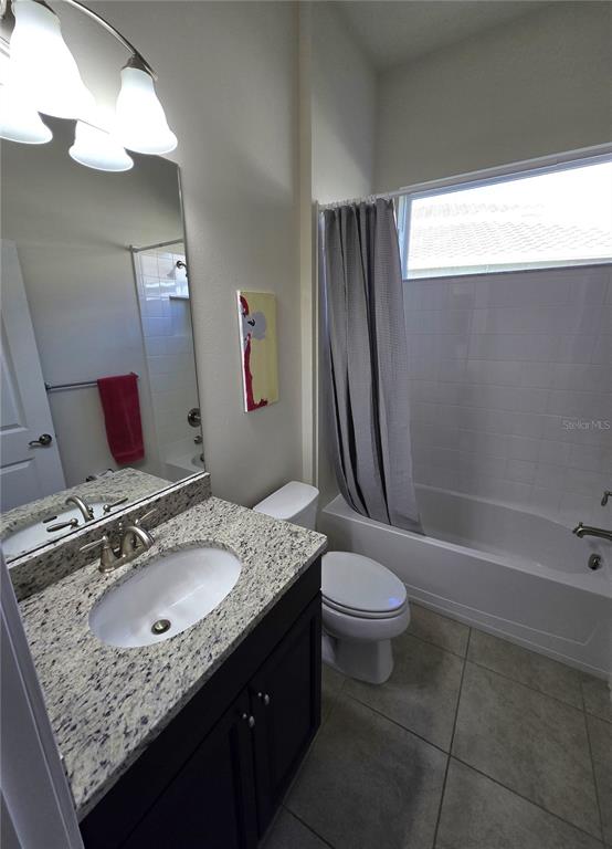 11925 Perennial Place Lakewood Ranch, FL 34211 - Photo 24 of 39 a bathroom with a granite countertop sink toilet and shower