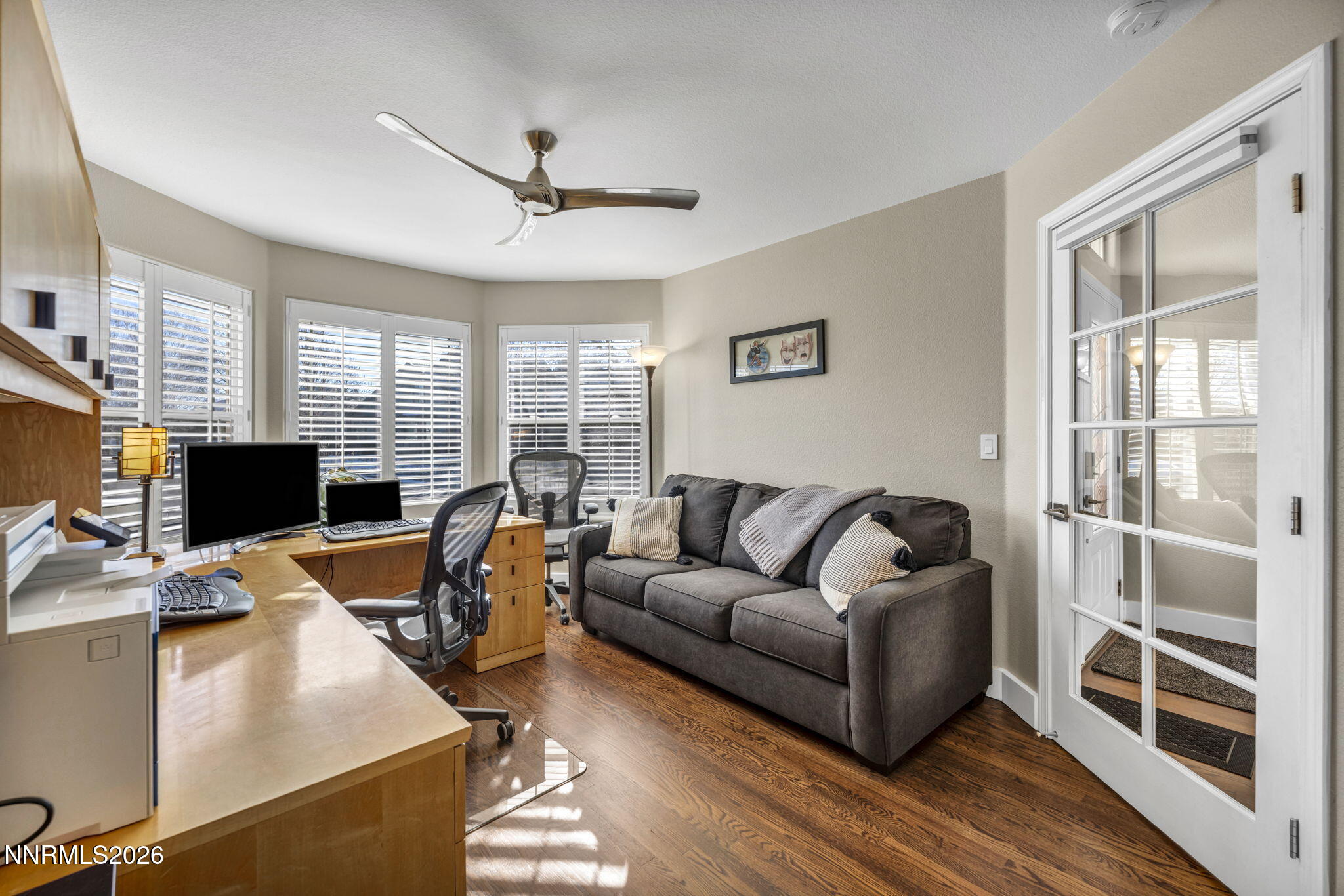 2296 Oak Ridge Drive Carson City, NV 89703 - Photo 29 of 71 a living room with furniture a flat screen tv and a window