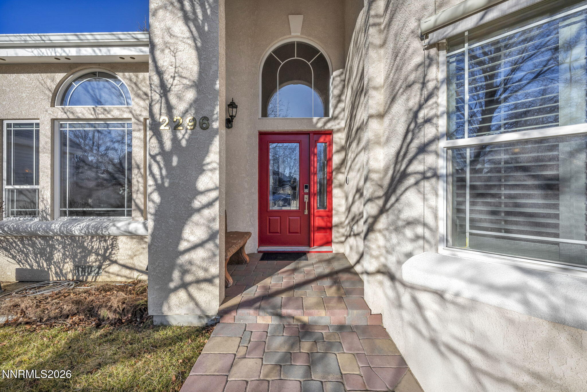 2296 Oak Ridge Drive Carson City, NV 89703 - Photo 4 of 71 a front view of a house with a yard