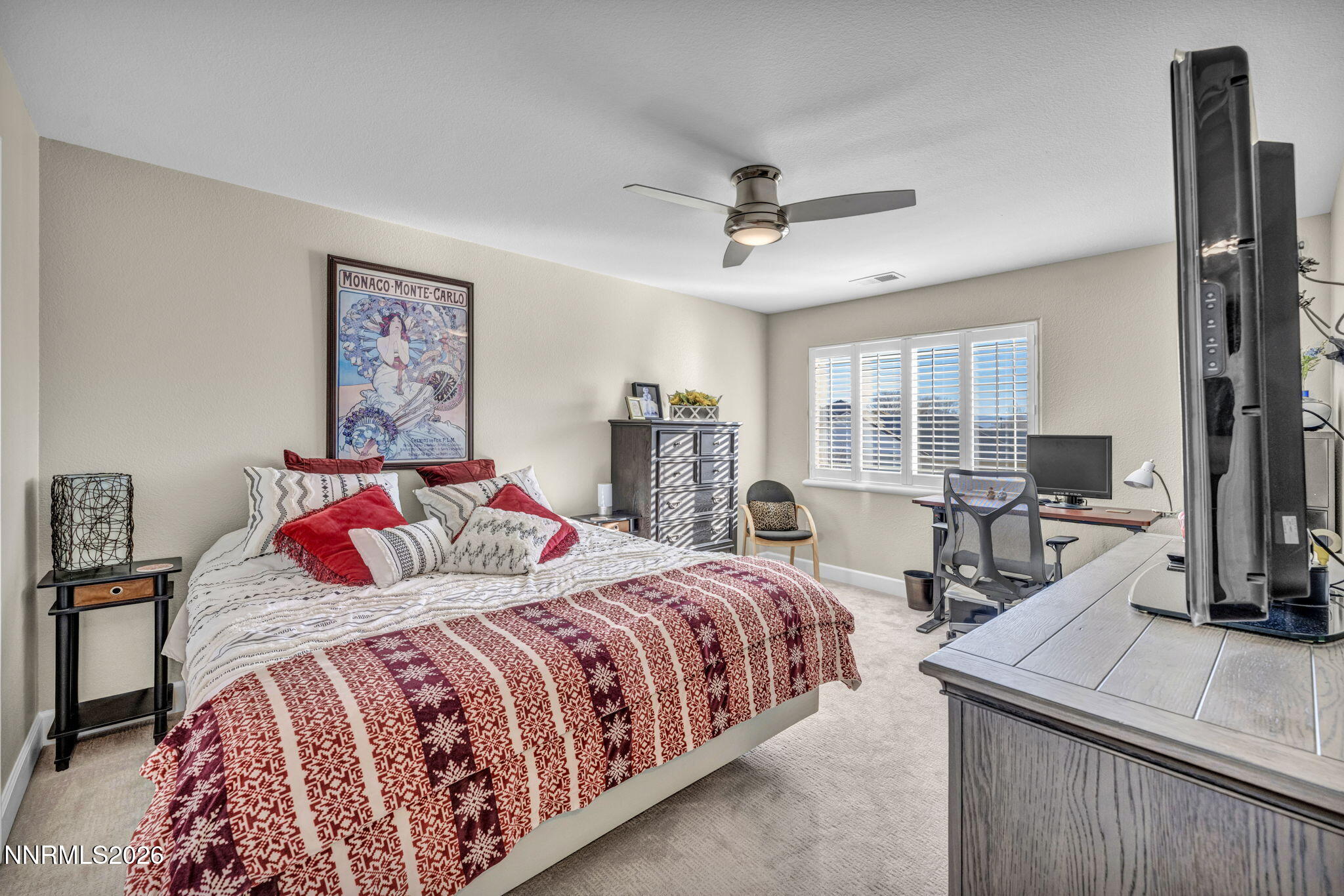 2296 Oak Ridge Drive Carson City, NV 89703 - Photo 45 of 71 a bedroom with a large bed and a flat tv screen on dresser