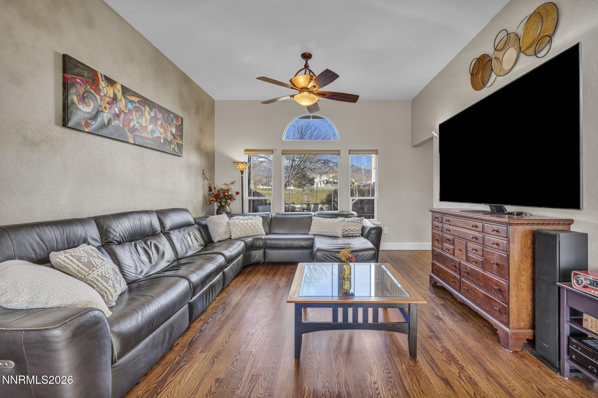 2296 Oak Ridge Drive Carson City, NV 89703 - Photo 6 of 71 a living room with furniture and a flat screen tv