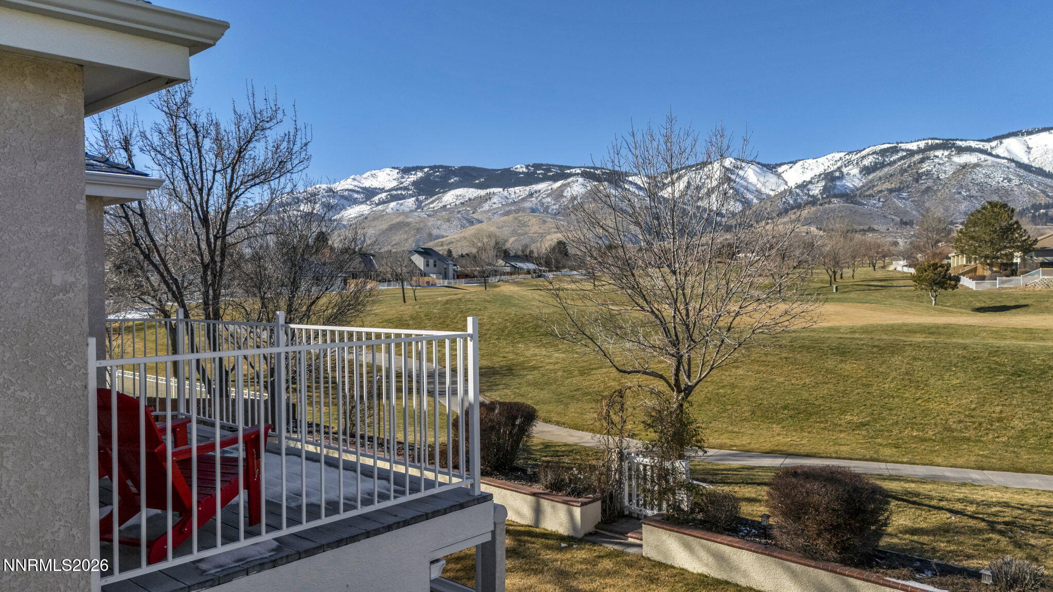2296 Oak Ridge Drive Carson City, NV 89703 - Photo 66 of 71 a view of a roof deck with wooden floor and fence