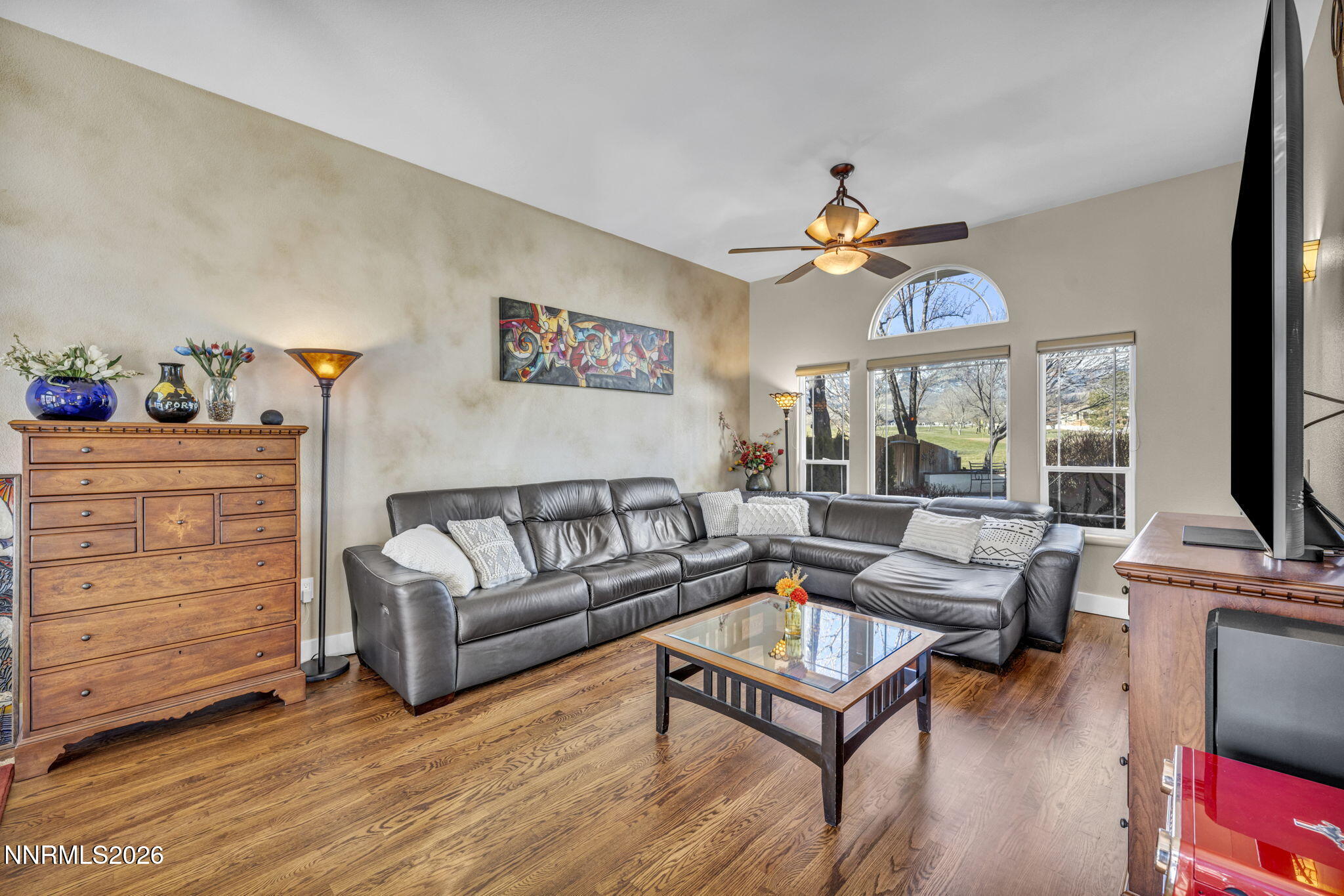 2296 Oak Ridge Drive Carson City, NV 89703 - Photo 7 of 71 a living room with furniture a flat screen tv and a window