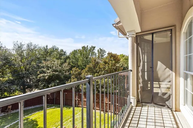 a view of balcony with wooden floor