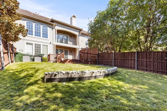 a view of an house with swimming pool and sitting area