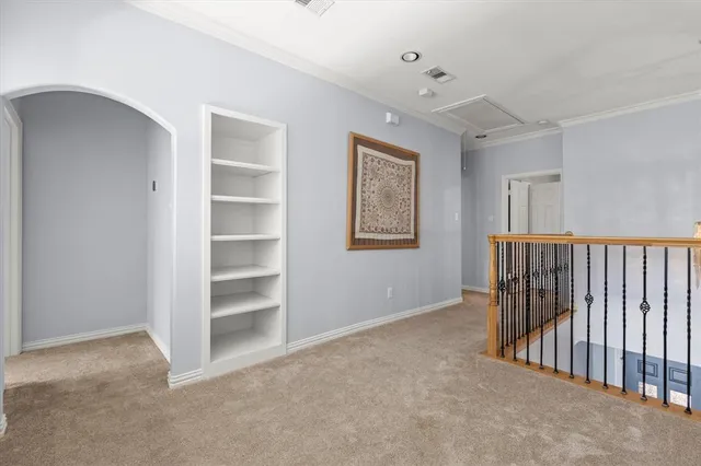 a view of a livingroom with an empty space and a window
