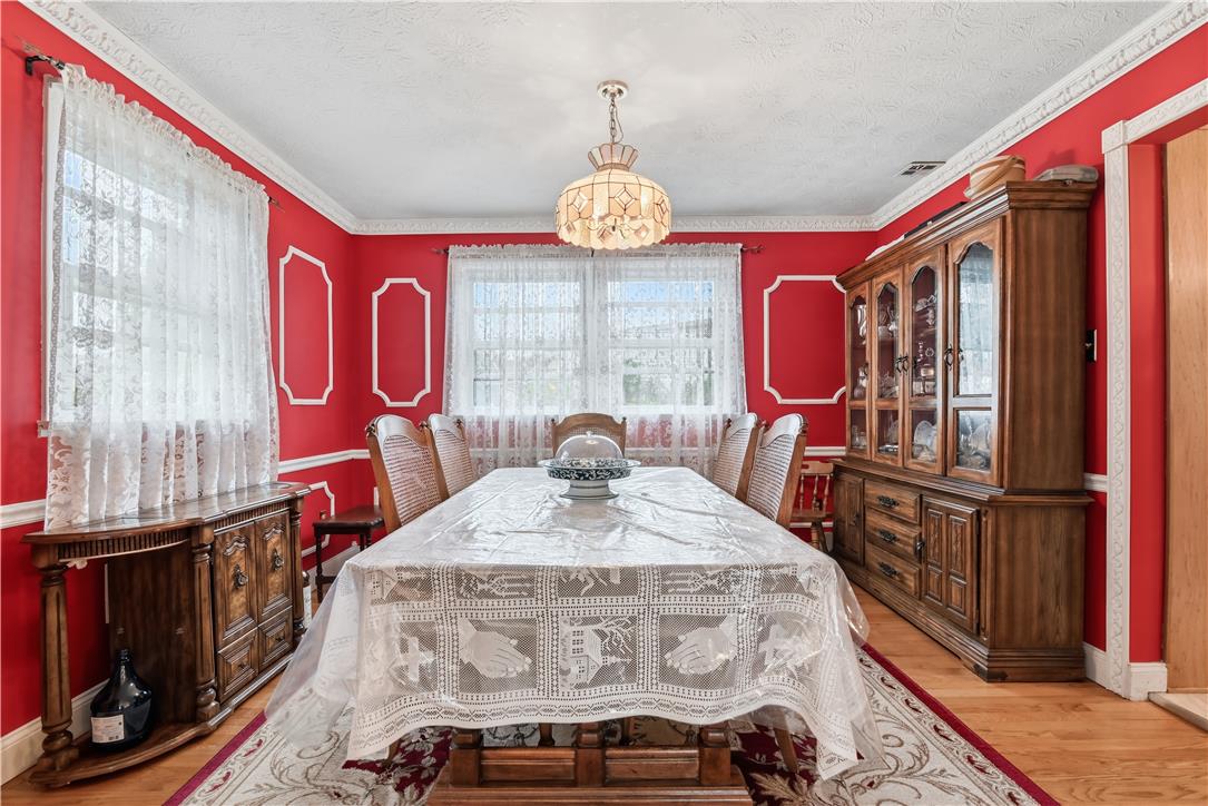 3303 Barklay Road Whitehall, PA 18052 - Photo 8 of 31 A formal dining room provides an elegant setting for meals with hardwood flooring and decorative crown molding.