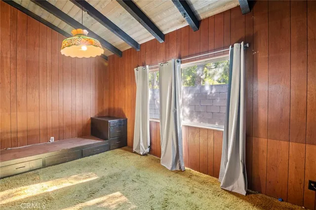 a view of a livingroom with furniture and staircase