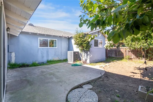 a view of a small yard with wooden fence