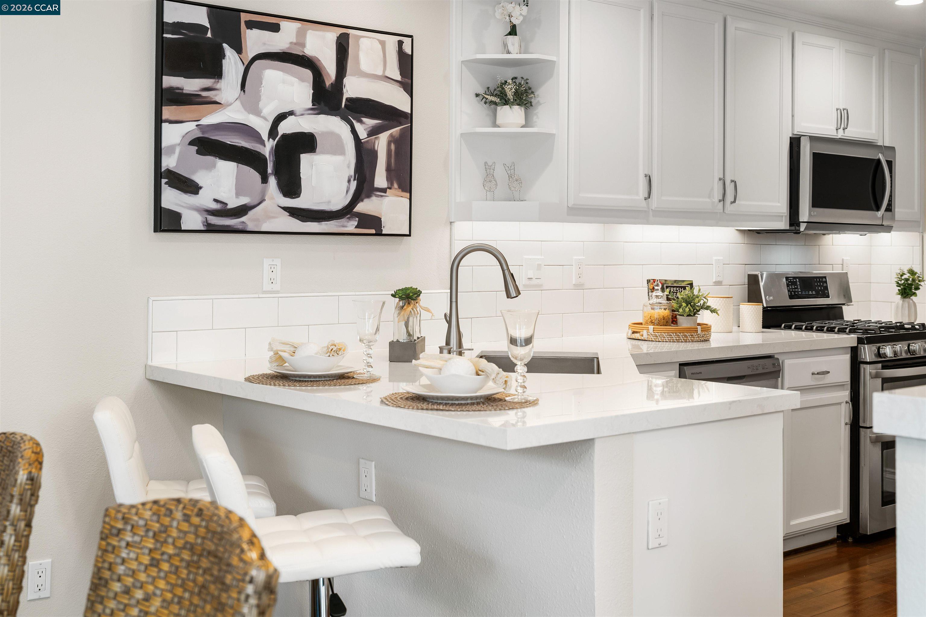 7151 Briza Loop San Ramon, CA 94582 - Photo 12 of 29 a kitchen with a sink cabinets and stainless steel appliances