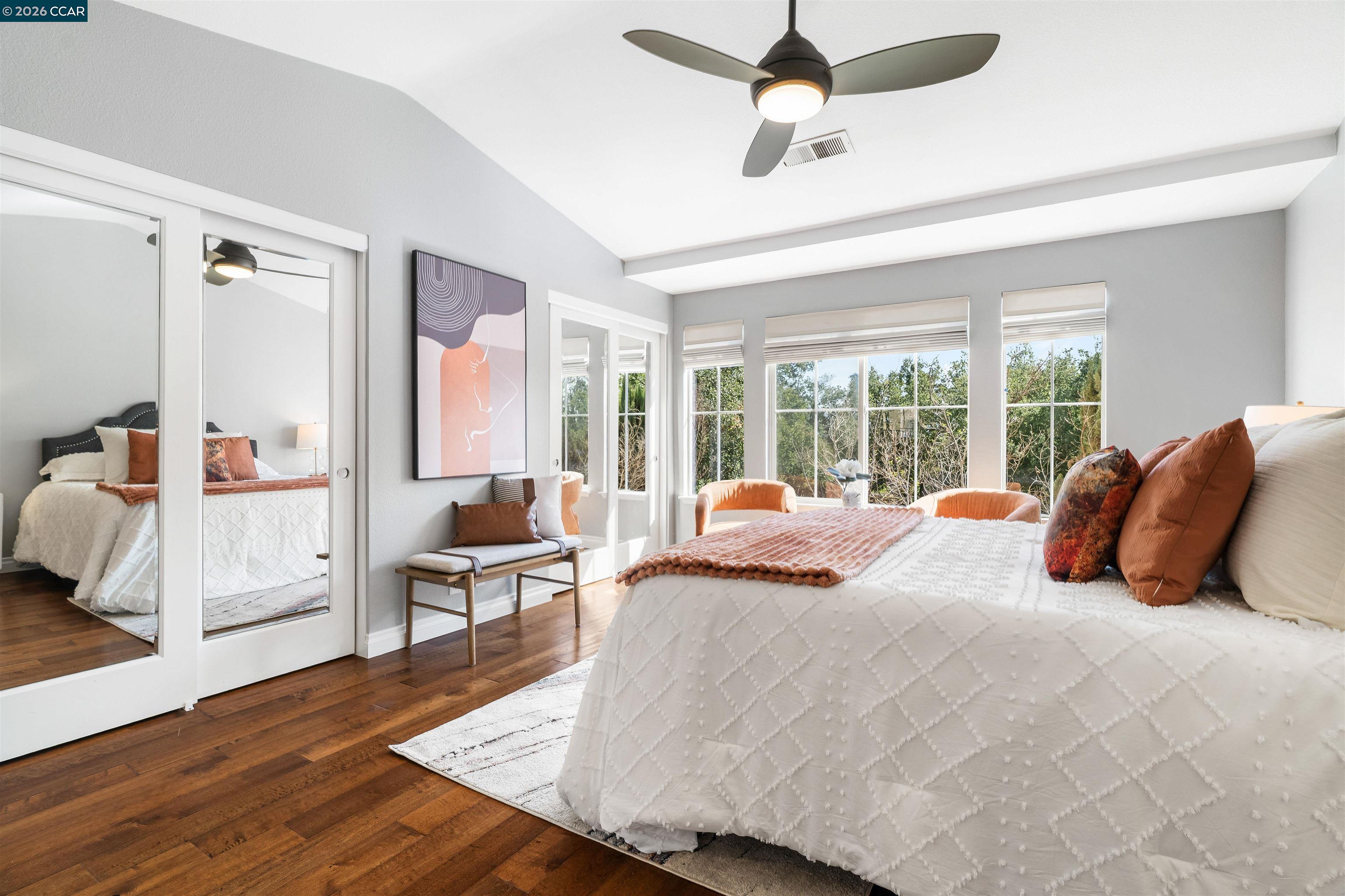 7151 Briza Loop San Ramon, CA 94582 - Photo 15 of 29 a bedroom with a bed and large windows