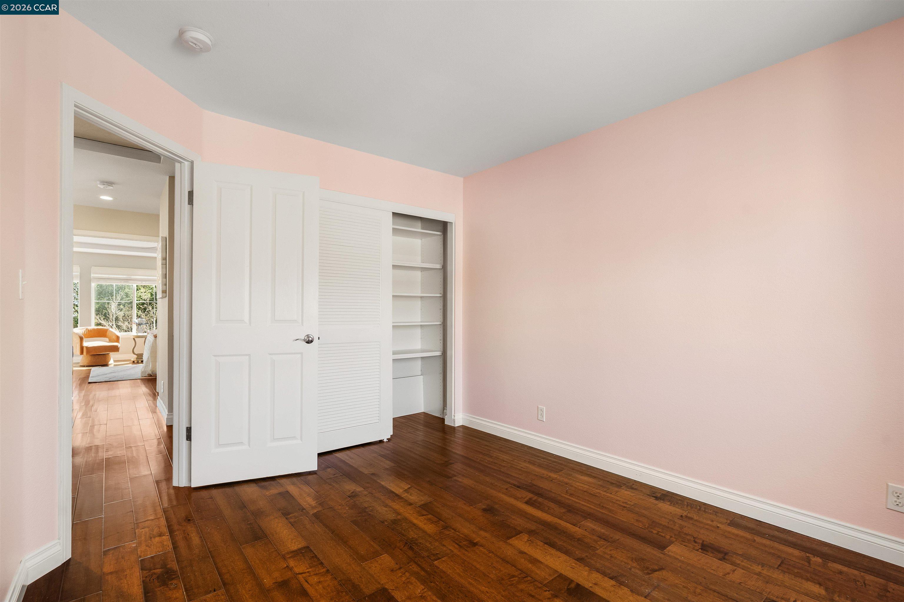 7151 Briza Loop San Ramon, CA 94582 - Photo 22 of 29 a view of empty room with wooden floor