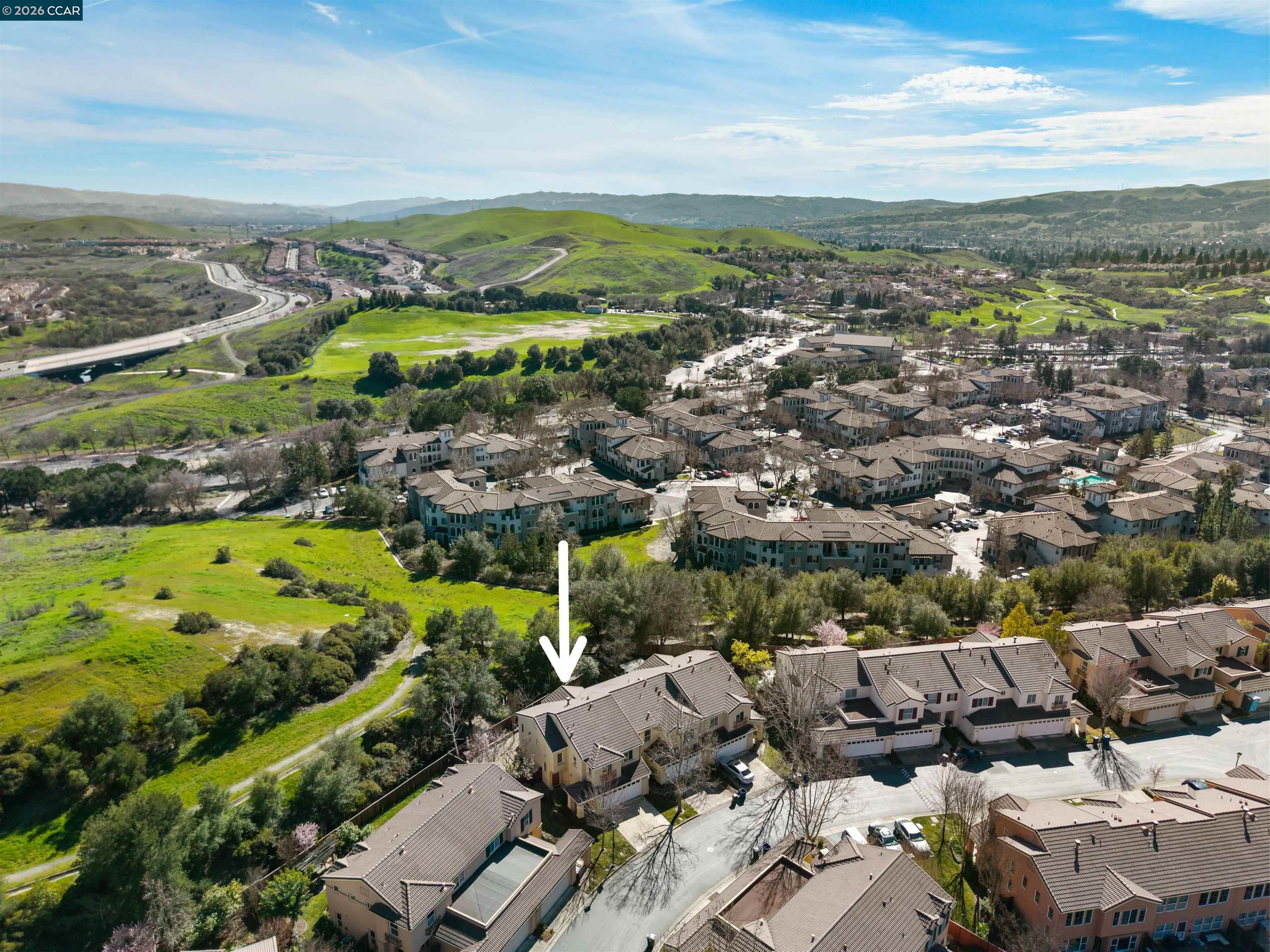 7151 Briza Loop San Ramon, CA 94582 - Photo 28 of 29 an aerial view of a city with lots of residential buildings and mountain view in back