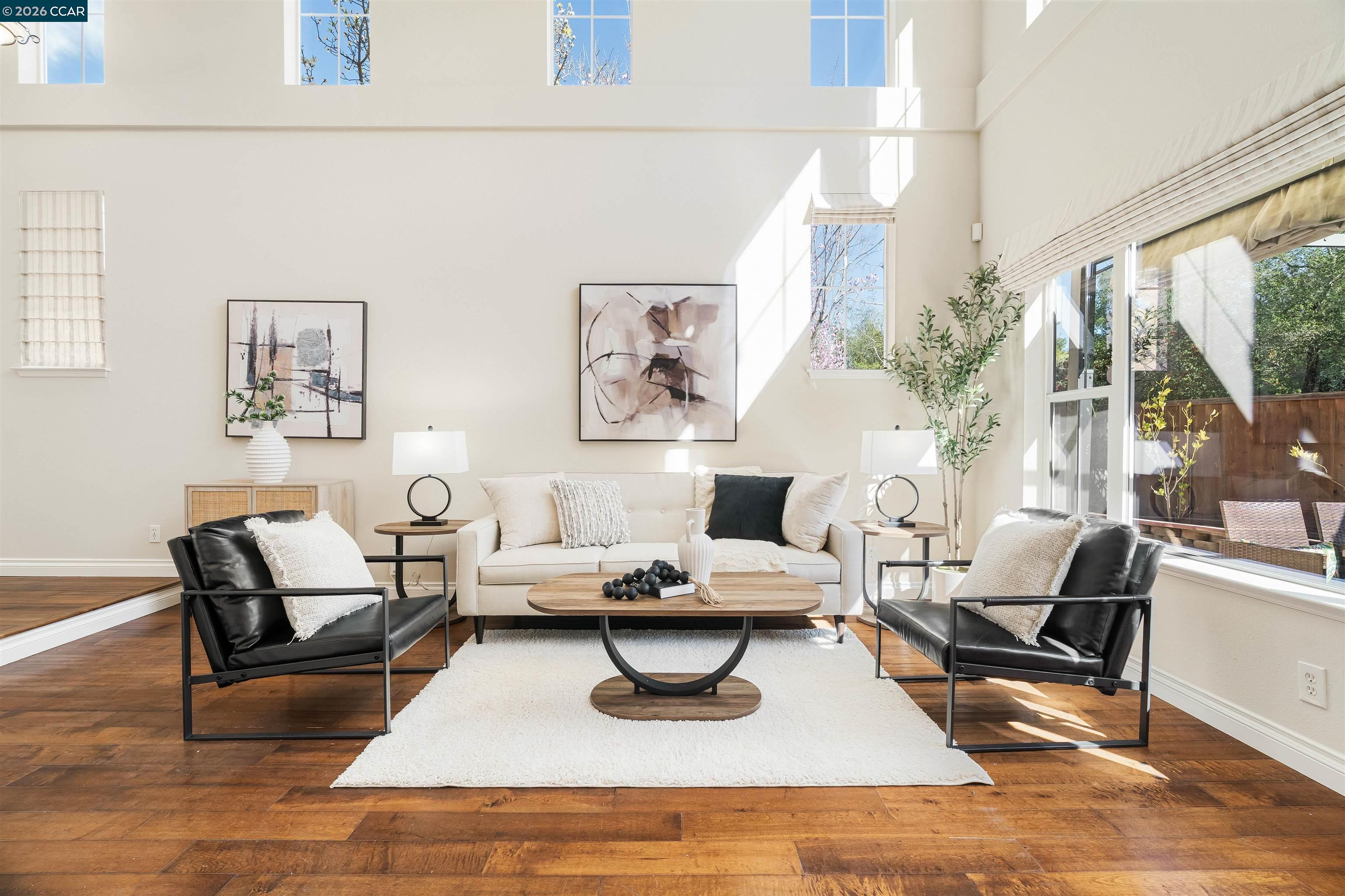 7151 Briza Loop San Ramon, CA 94582 - Photo 3 of 29 a living room with furniture large window and a table