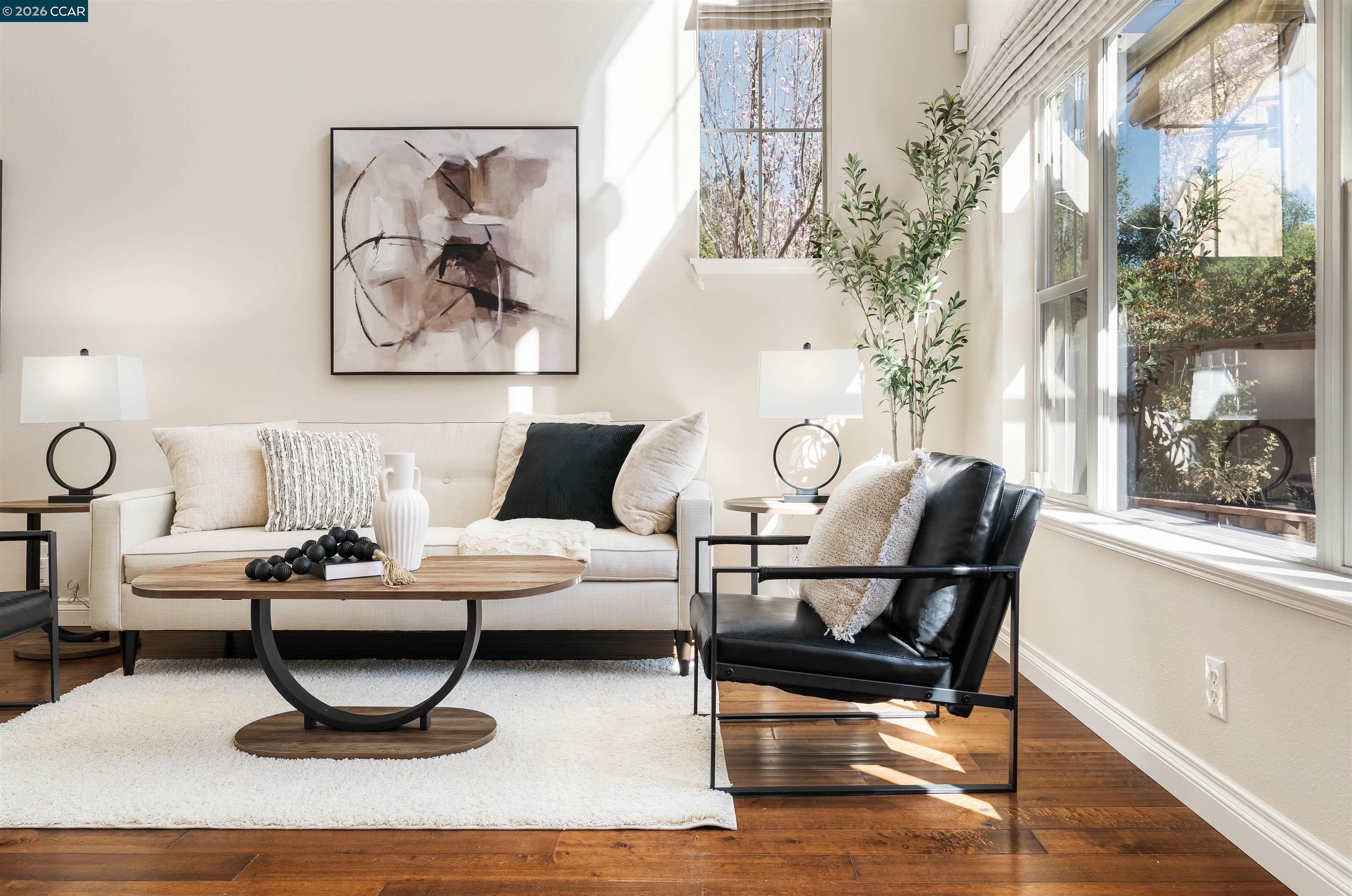 7151 Briza Loop San Ramon, CA 94582 - Photo 6 of 29 a living room with furniture and wooden floor