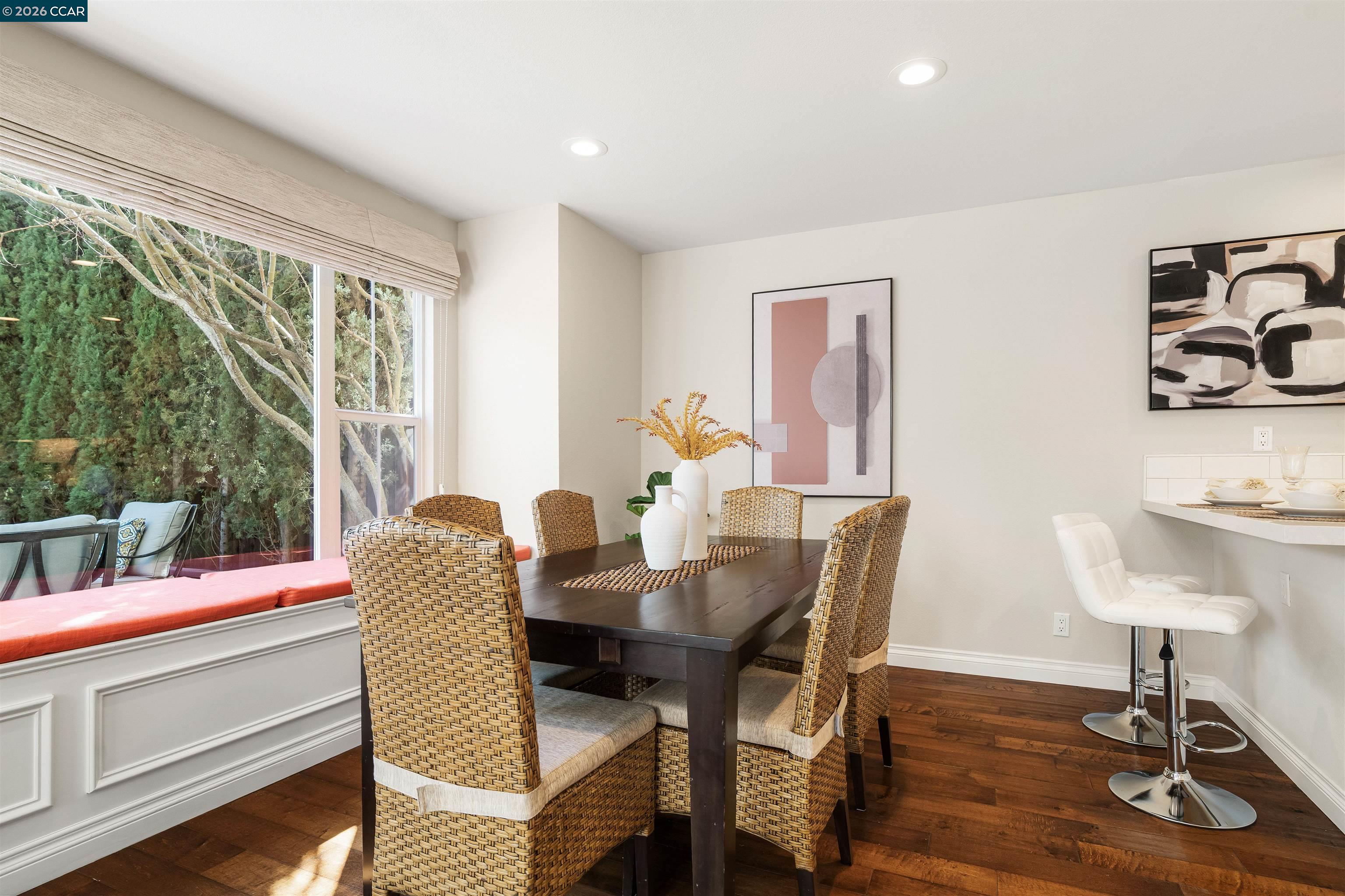 7151 Briza Loop San Ramon, CA 94582 - Photo 7 of 29 a dining room with furniture and wooden floor