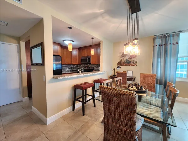 a living room with furniture rug and window
