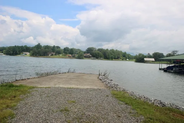 a view of a lake view with houses in back