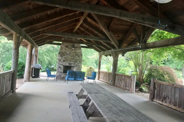 a view of a porch with furniture and backyard